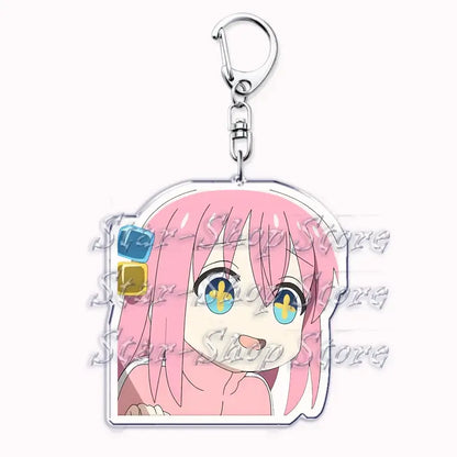 Pink-haired hitori gotoh keychain with blue and yellow eyes clear acrylic design and silver metal clasp from bocchi the rock