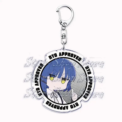 Clear acrylic keychain featuring chibi hitori gotoh with blue hair yellow eyes and ryo approved text in black lettering