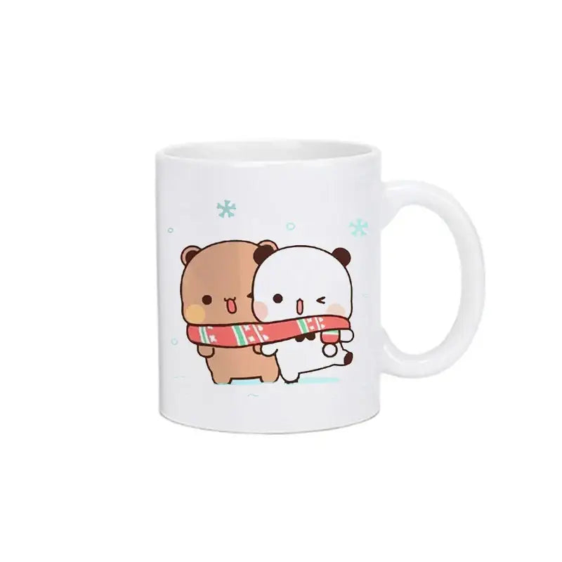 White ceramic bubu dudu panda bear Christmas mug with cute brown and white bears hugging in red and green scarf