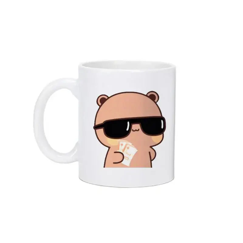 White ceramic mug featuring bubu dudu panda bear wearing sunglasses and holding cards in kawaii style