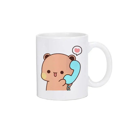 White ceramic bubu dudu panda bear christmas mug with cute peach bear holding blue phone and pink heart bubble