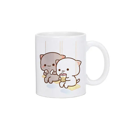 White ceramic bubu dudu panda bear christmas mug featuring cute gray and white cartoon cats with boba tea on yellow mats