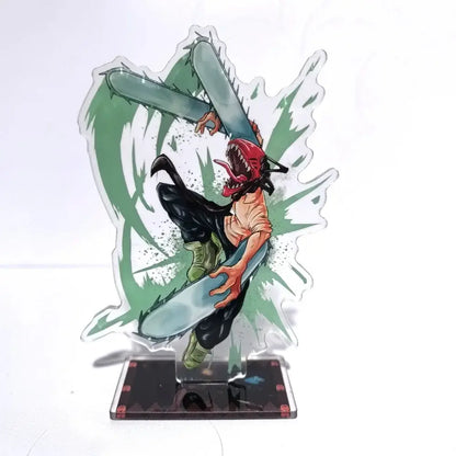 Clear acrylic chainsaw man denji stand with red mask and chainsaw mid-air on green splatter desktop decor 15cm