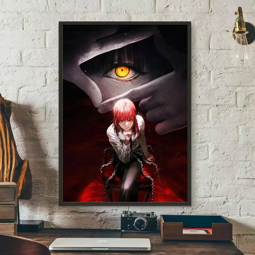 Black-framed chainsaw man wall art featuring red-haired denji in chains beneath a hand with an orange eye on canvas