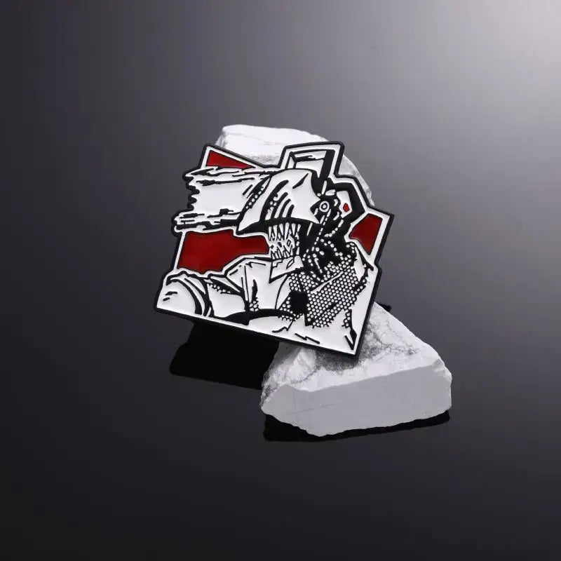 Chainsaw man denji enamel pin featuring a black and white shark design with red accents on a fragmented background