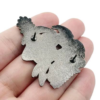 Silver metallic chainsaw man denji enamel pin with stylized curly hair and cut-out facial features for man anime fans