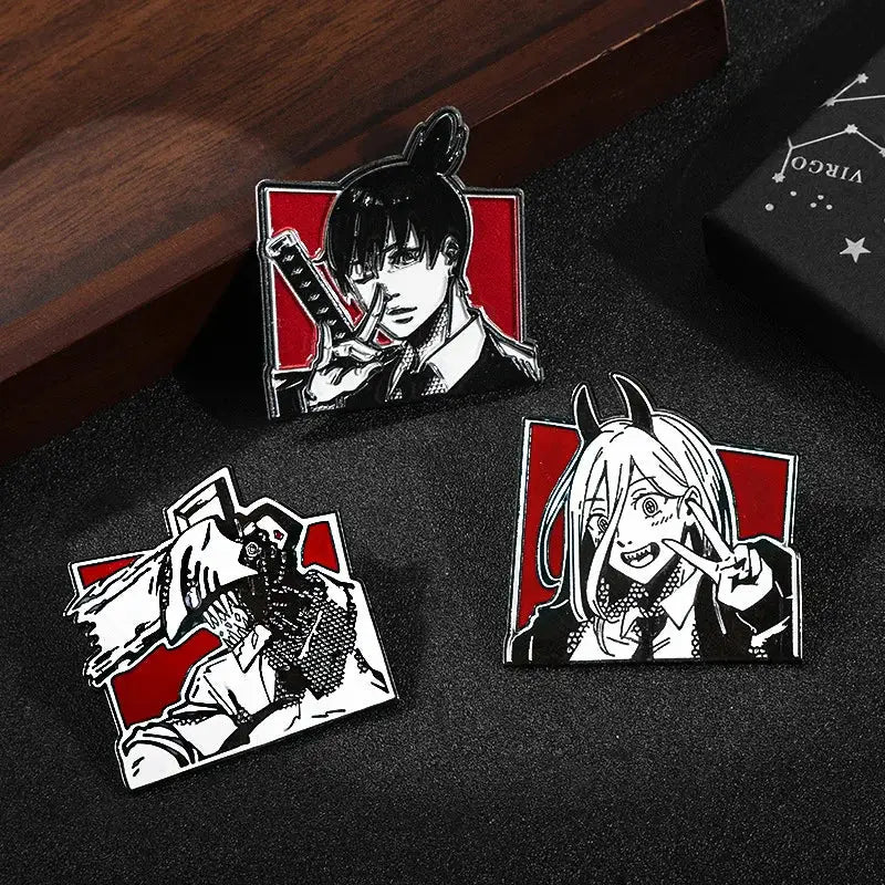 Three chainsaw man anime enamel pins with black-and-white character designs on a red background kawaii brooches