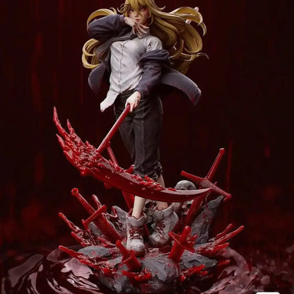 A detailed resin statue of blonde chainsaw man denji wielding a large red sword with blood effects from a mystery box gold editions