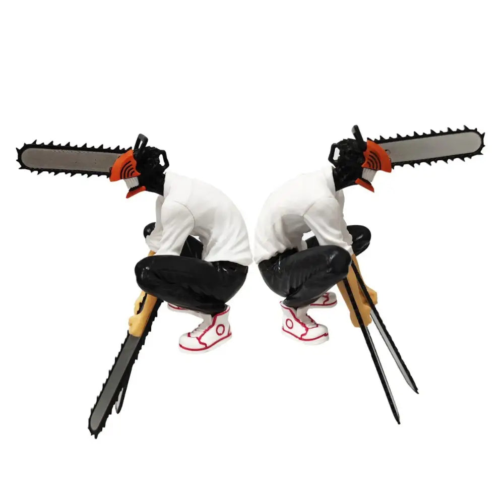 Two identical black and white chainsaw man denji pvc figures with chainsaw heads white shirts and red sneakers collectible