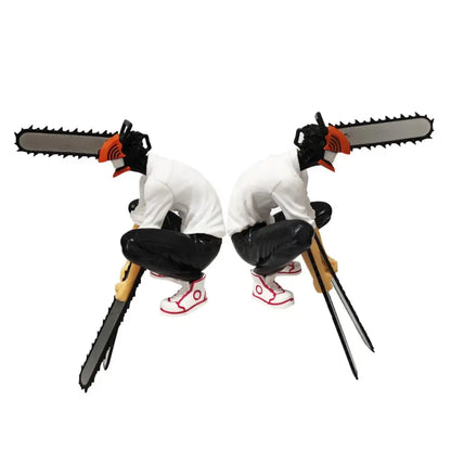 Two identical black and white chainsaw man denji pvc figures with chainsaw heads white shirts and red sneakers collectible