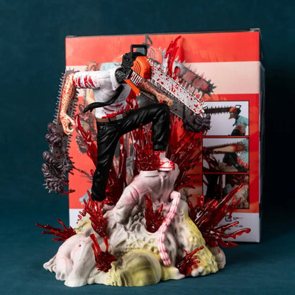 A detailed plastic chainsaw man denji pvc statue 29cm battle scene wielding an orange chainsaw with blood splatters