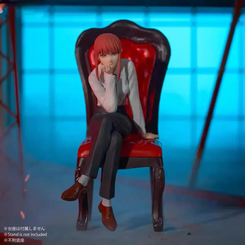 Chainsaw man makima bunny figure next to a red and black upholstered chair with an ornate wooden frame