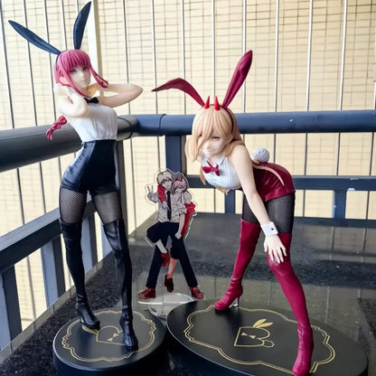 Two detailed chainsaw man pvc anime figurines with pink and blonde hair wearing black and white bunny outfits