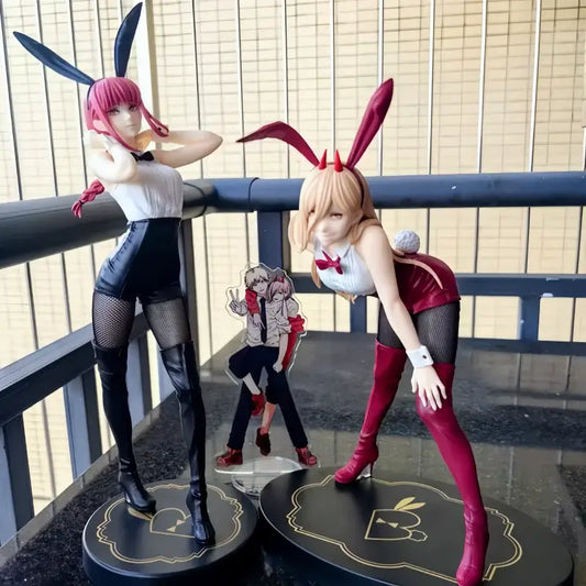 Two detailed chainsaw man pvc anime figurines with pink and blonde hair wearing black and white bunny outfits