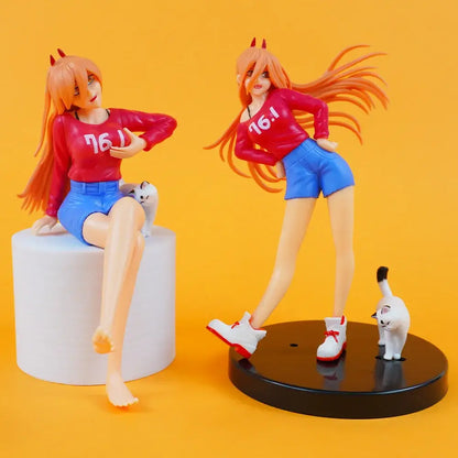 Two orange-haired chainsaw man makima anime figures with red devil horns in scene ornament design on white and black bases