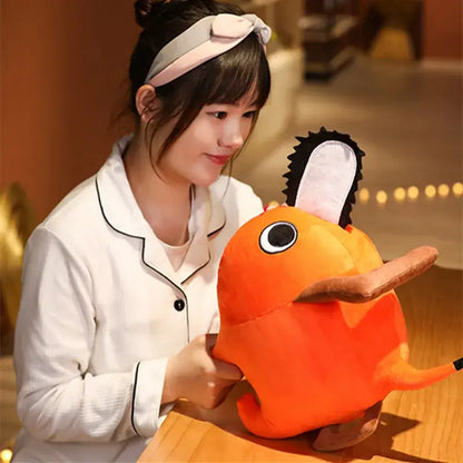 Orange soft stuffed plush pendant of pochita with a chainsaw blade head and brown feet pillow design