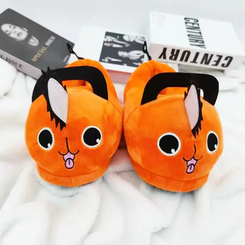Orange soft plush slippers shaped like pochita from chainsaw man with black and white accents
