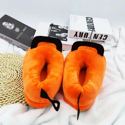 Orange pochita plush slippers shaped like a pumpkin with soft fabric and tail detail for cozy wear
