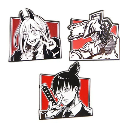 Set of three black-and-white anime enamel pins with red backgrounds featuring loop backing for easy attachment