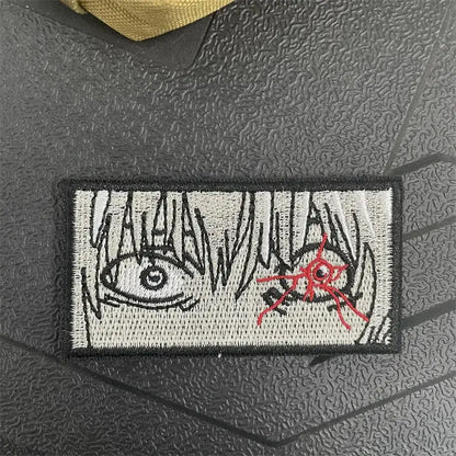 Chainsaw man power embroidery patch with hook-and-loop backing featuring anime eye and red spider design on gray background