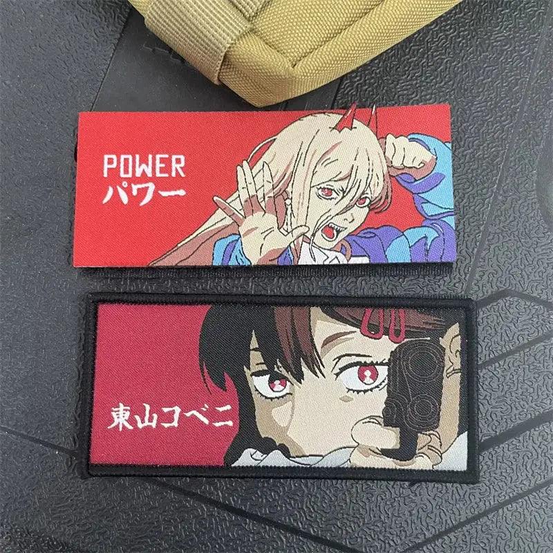 Two red chainsaw man tactical patches with hook-and-loop backing featuring power and dark-haired characters