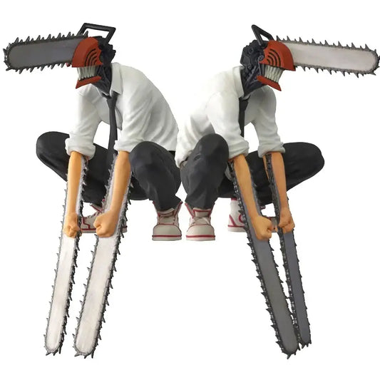 Two chainsaw man anime figures in white shirts black pants and chainsaw heads designed as noodle stopper pvc figures