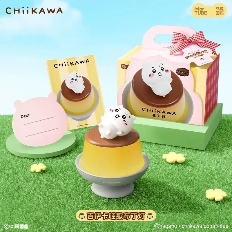 A cute white chiikawa figurine with rosy cheeks sits on a yellow pudding desk lamp for bedroom atmosphere light