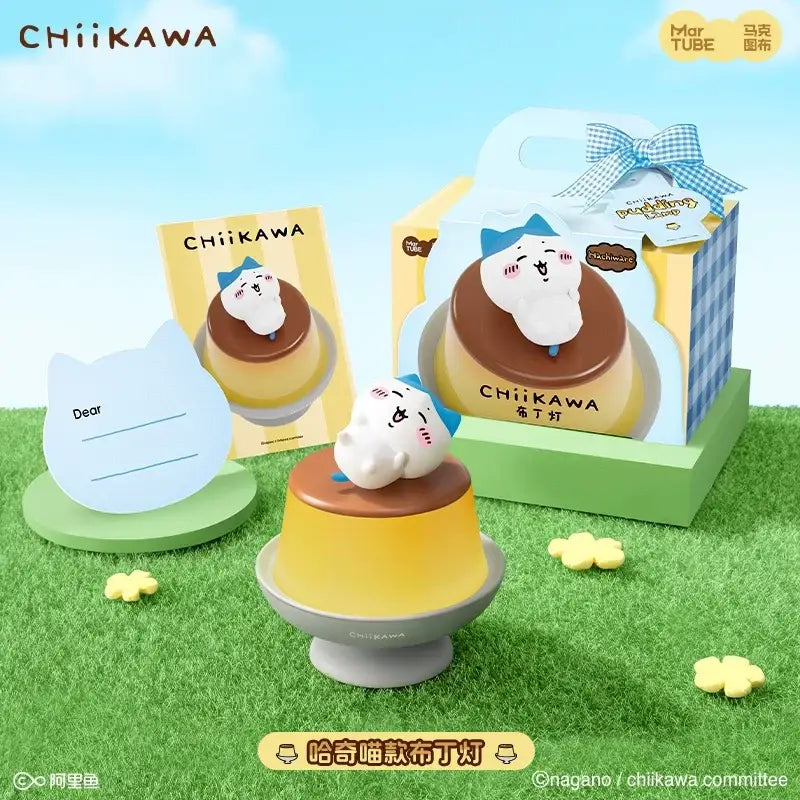 Cute white chiikawa cat figurine with blue bow on yellow flan dessert lamp base for bedroom atmosphere light