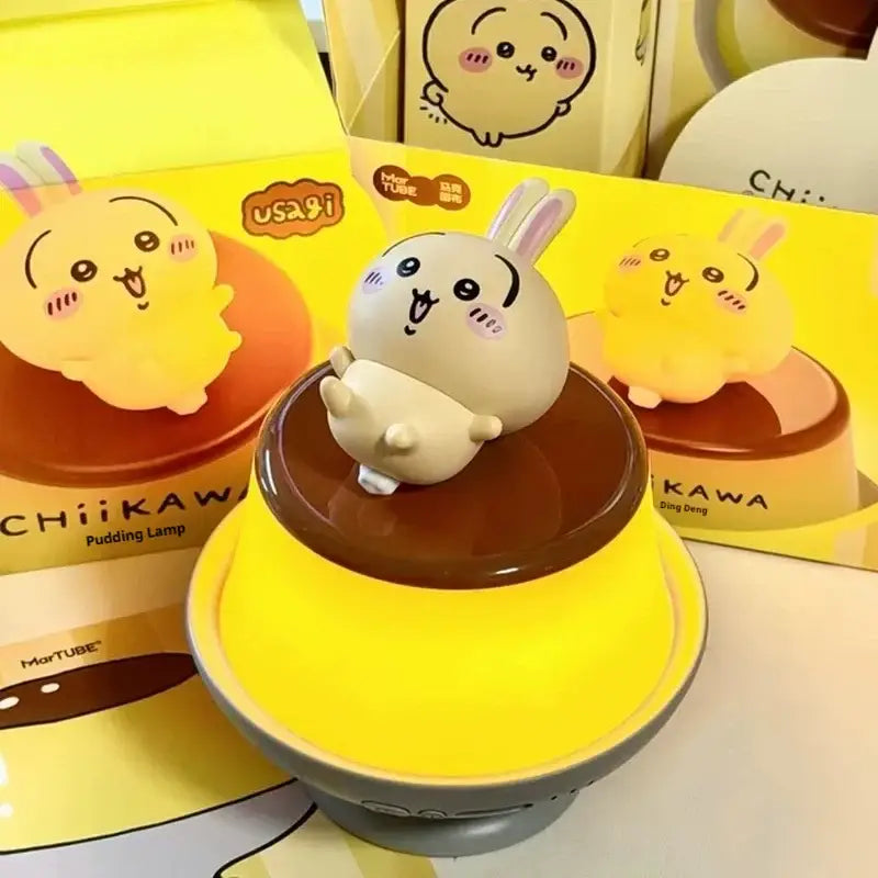 Chiikawa hachiware and usagi led lamp features a beige rabbit figurine on a glossy brown dome with a yellow base for bedroom atmosphere