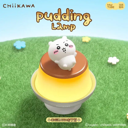 A white plush chiikawa character sits atop a layered pudding led lamp creating a warm bedroom atmosphere light