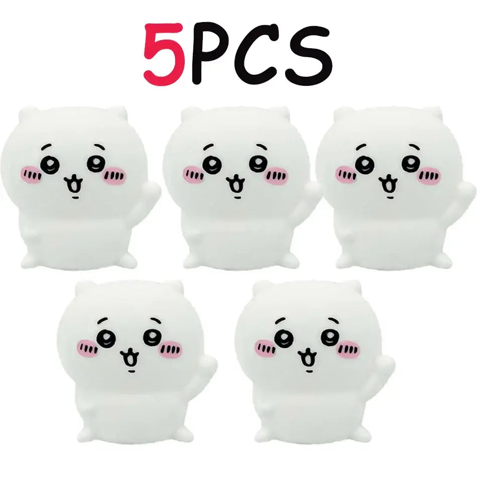White plush cartoonish cat-shaped vinyl doll stress relievers with pink cheeks and black eyes for luminous night light use