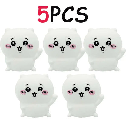 White plush cartoonish cat-shaped vinyl doll stress relievers with pink cheeks and black eyes for luminous night light use