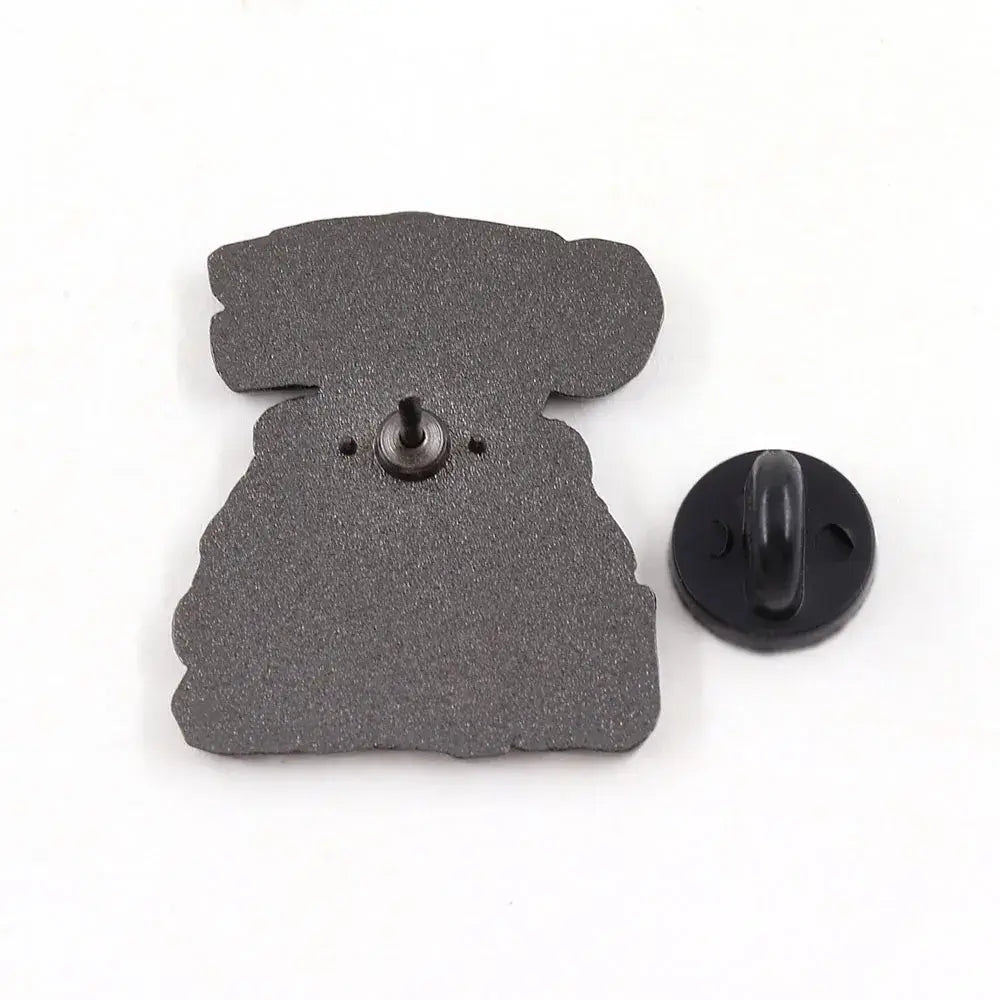Black cookie monster enamel pin shaped like a stylized robot with matte textured finish cartoon brooch