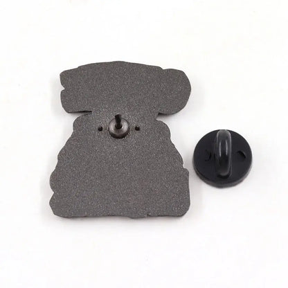Black cookie monster enamel pin shaped like a stylized robot with matte textured finish cartoon brooch