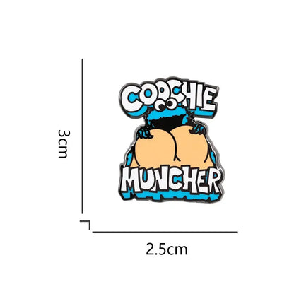 Blue and black cookie monster enamel pin cartoon brooch featuring a cookie monster holding cookies with text cochie muncher