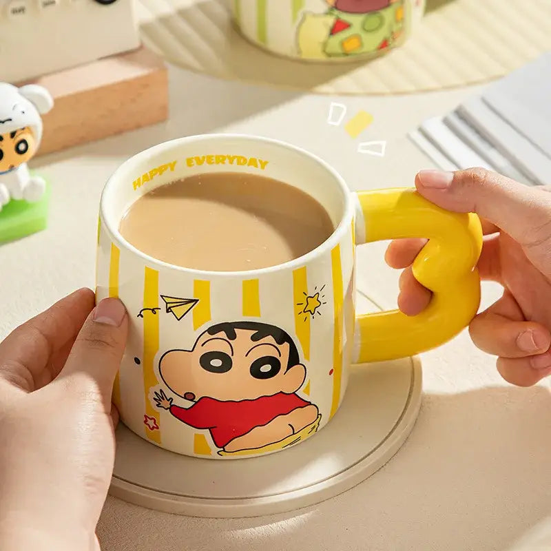 Yellow and white striped shin chan ceramic mug with bright yellow m-handle and cartoon character design