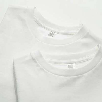 Three crisp white cotton short sleeve t-shirts with clean round necklines ideal for daily wear custom graphic tee
