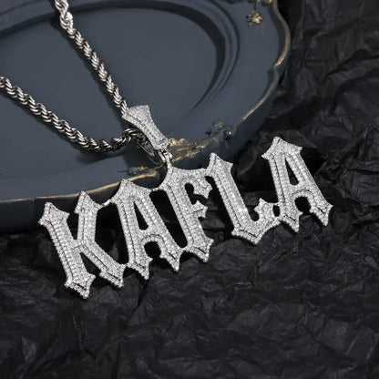 A sparkling silver stone spiked letter pendant necklace with gothic font and clear cubic zirconia stones on rope chain