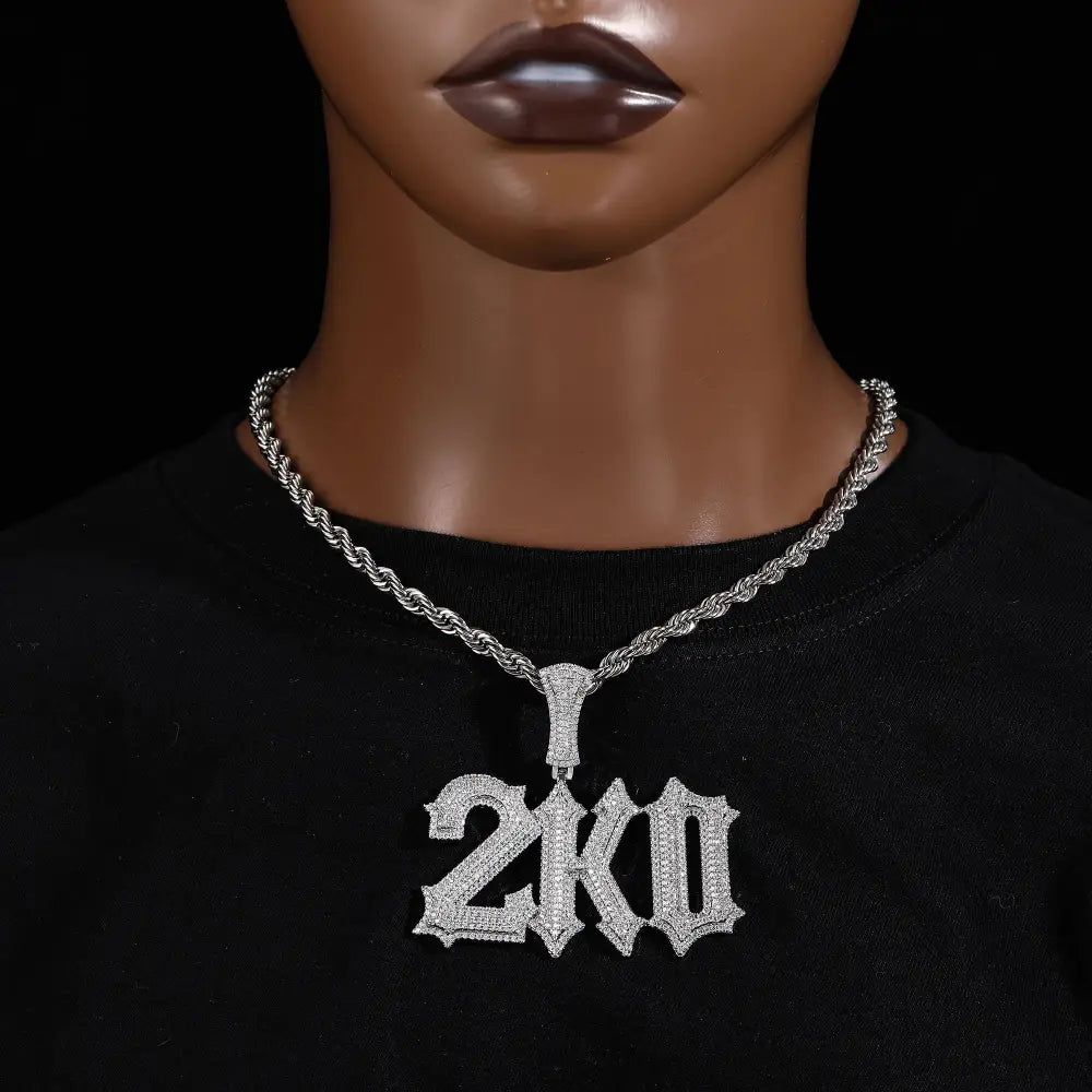 Silver ice cube letter pendant necklace with stone spiked detail and braided rope chain for custom jewelry