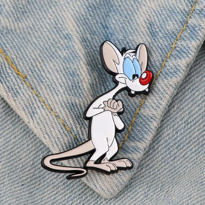 Cute mouse enamel pin featuring white and pink colors with blue eyes red nose black outlines and enamel finish