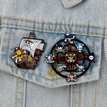 Two colorful enamel pins in a cute ship enamel pin set featuring a skull flag ship and compass rose with pirate skulls