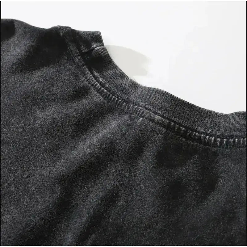 Black cotton unisex t-shirt with ribbed crew neck featuring dark manga pattern for street style look