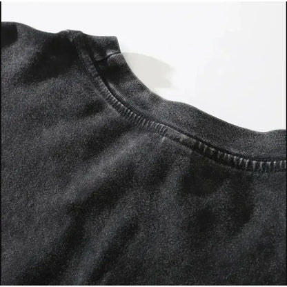 Black cotton unisex t-shirt with ribbed crew neck featuring dark manga pattern for street style look