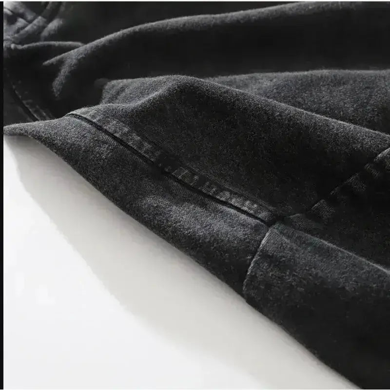 Dark manga pattern unisex t-shirt in dark gray denim fabric with visible stitching and worn texture for street style