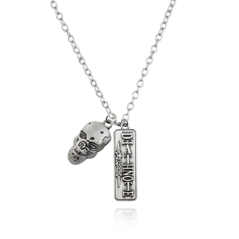 Silver-toned misa amane halberd pendant necklace featuring a detailed skull charm and engraved death note pendant