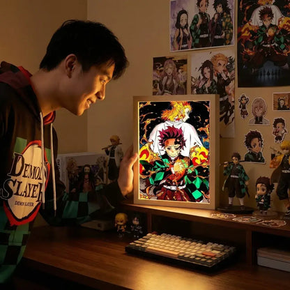 Demon slayer kyojuro rengoku led photo frame with vibrant red and green anime art and glowing orange flames night light
