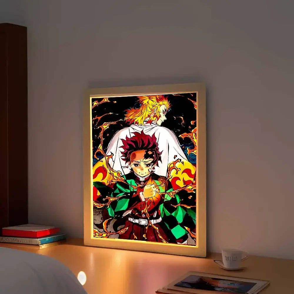 A glowing demon slayer kyojuro rengoku led photo frame with warm backlight in a light wood frame