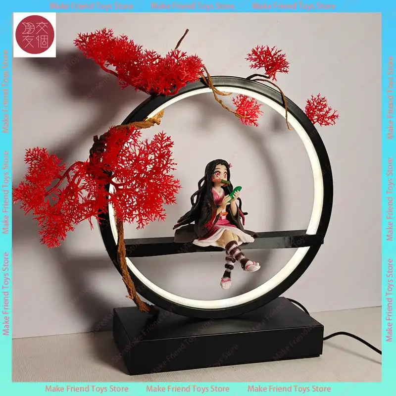 Black circular led night light with red artificial cherry blossoms and seated nezuko anime figurine inside illuminated ring