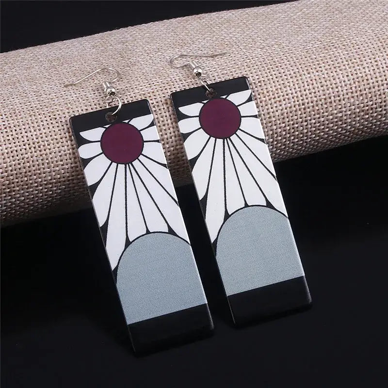 Demon slayer tanjiro black acrylic butterfly drop earrings with white daisy and maroon center design