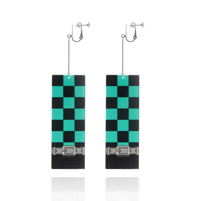 Black and teal checkered acrylic butterfly drop earrings with silver buckle detail inspired by demon slayer tanjiro
